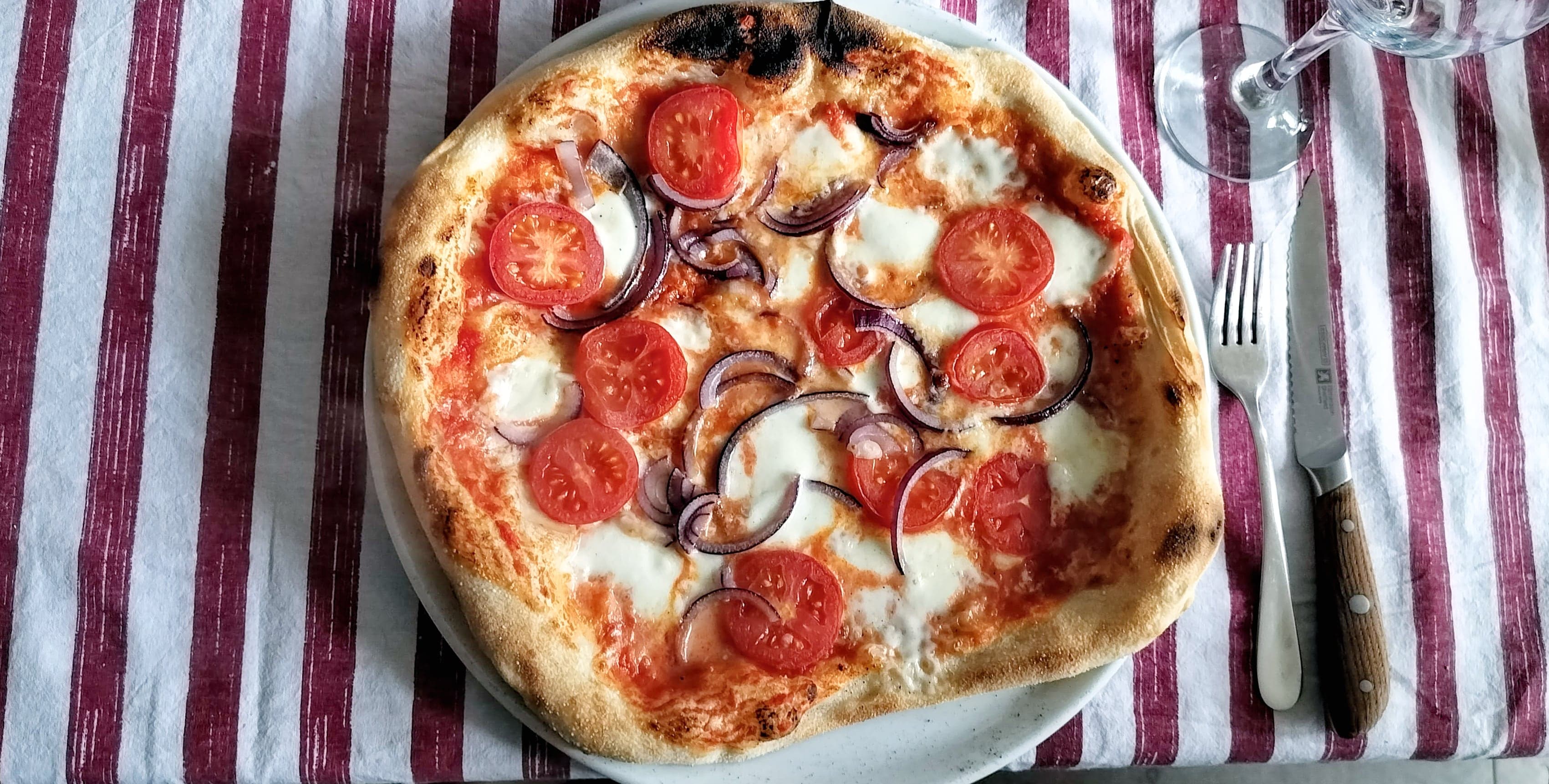 Osteria Cantabrigiana Pizza on Table